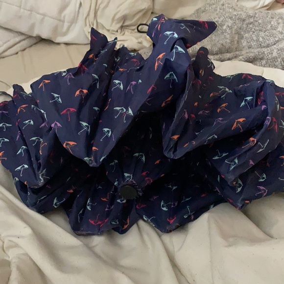 Small blue umbrella with little umbrella on it - Picture 2 of 2